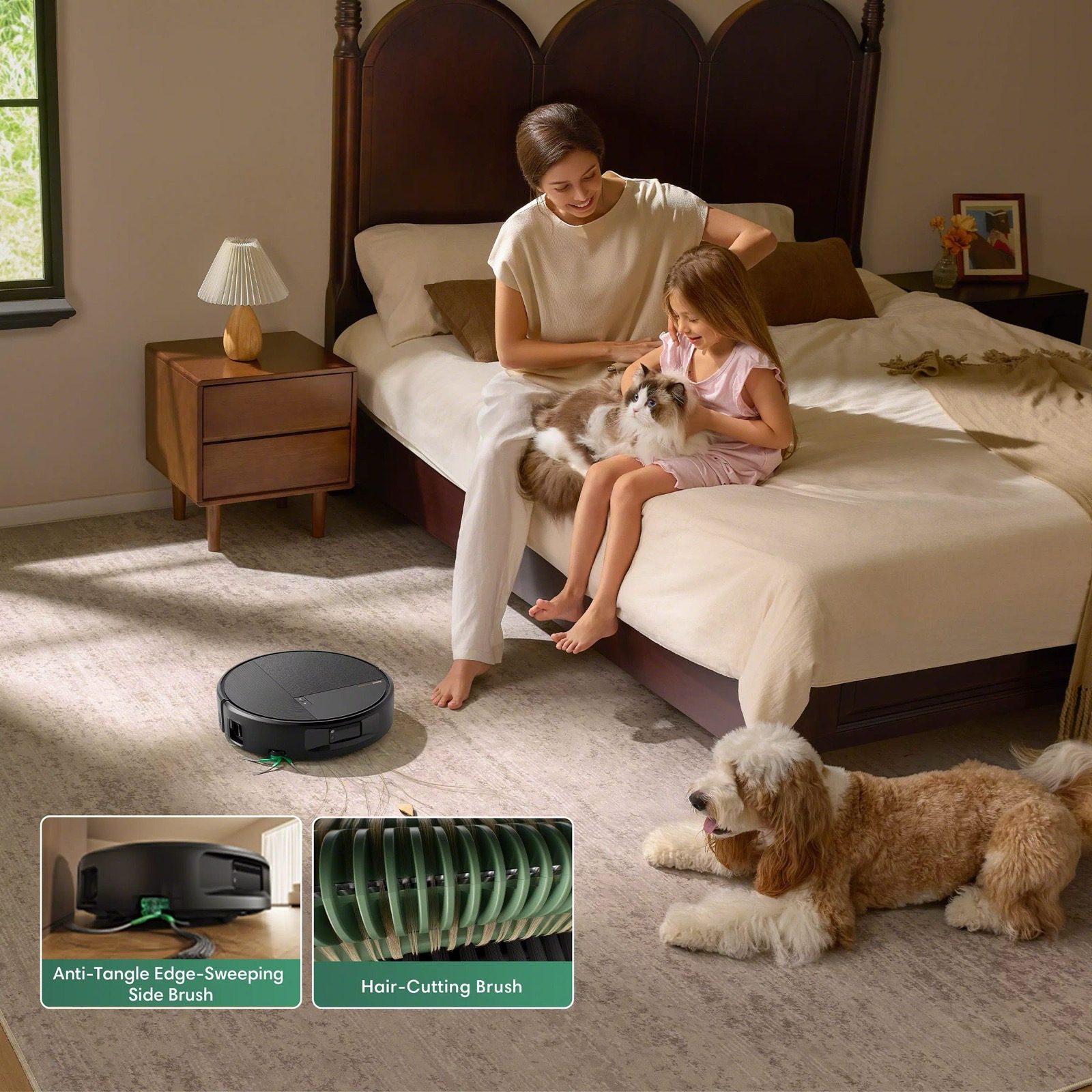 A Roomba&reg; robot cleaning the rug in a bedroom while a mother and daughter play with a cat on the bed and a dog lies on the floor