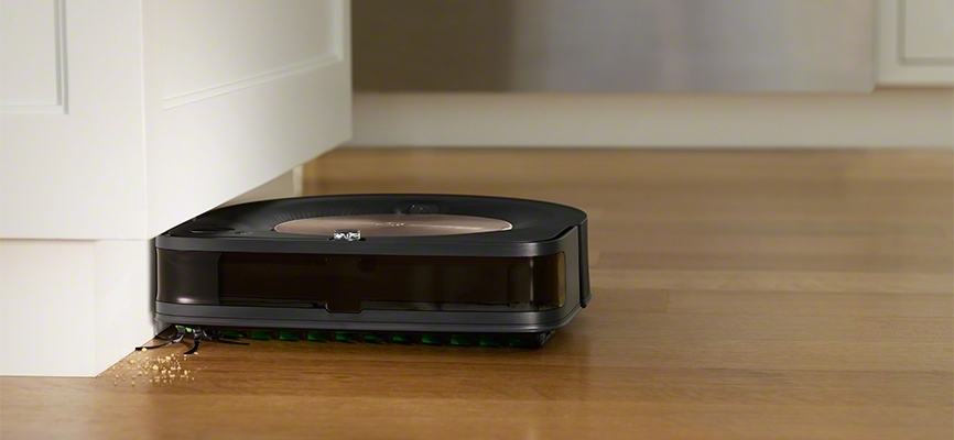 iRobot's Roomba s9 cleaning against the cabinet