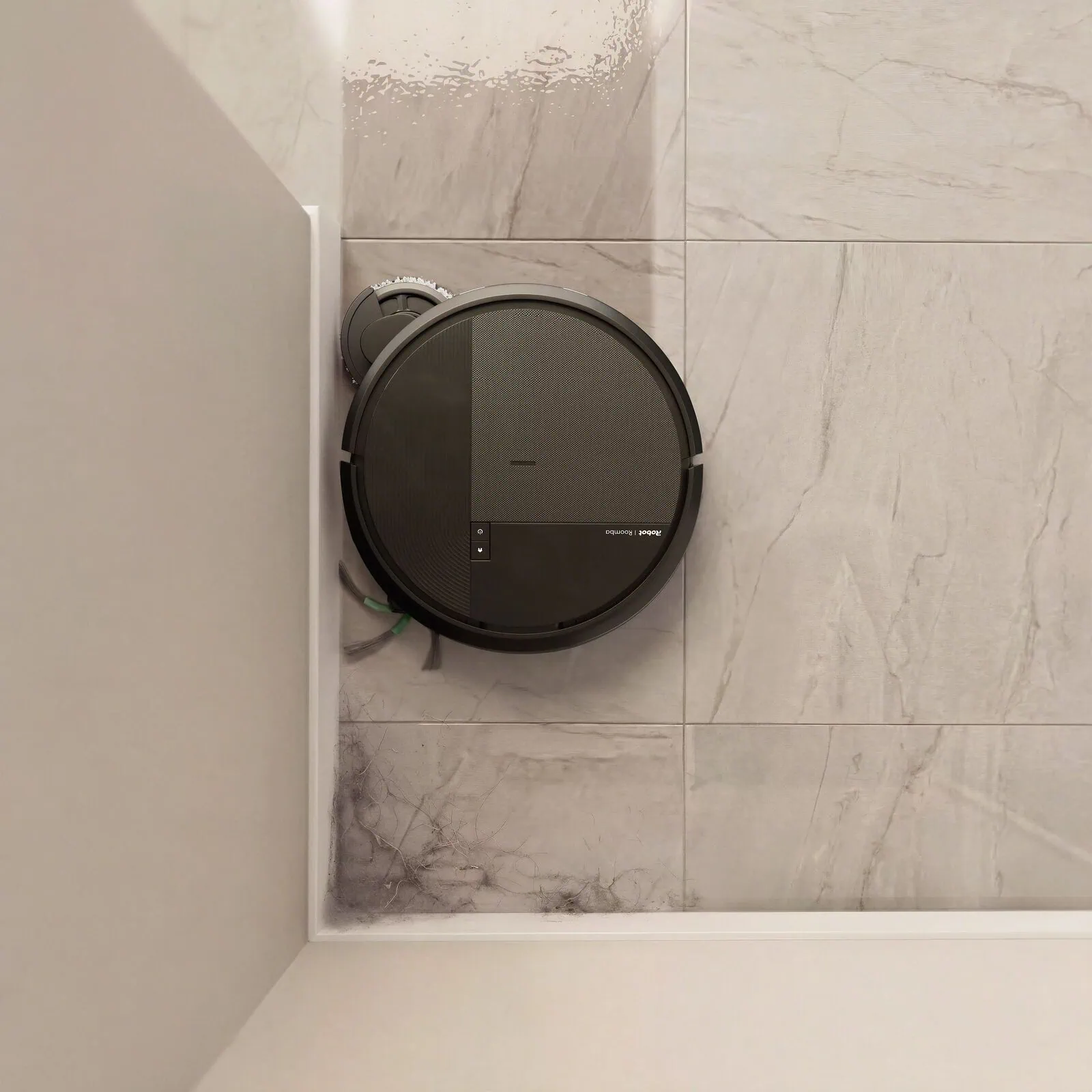 Roomba&reg; Plus 575 Combo robot extending its edge-sweeping brush to reach dust in a corner