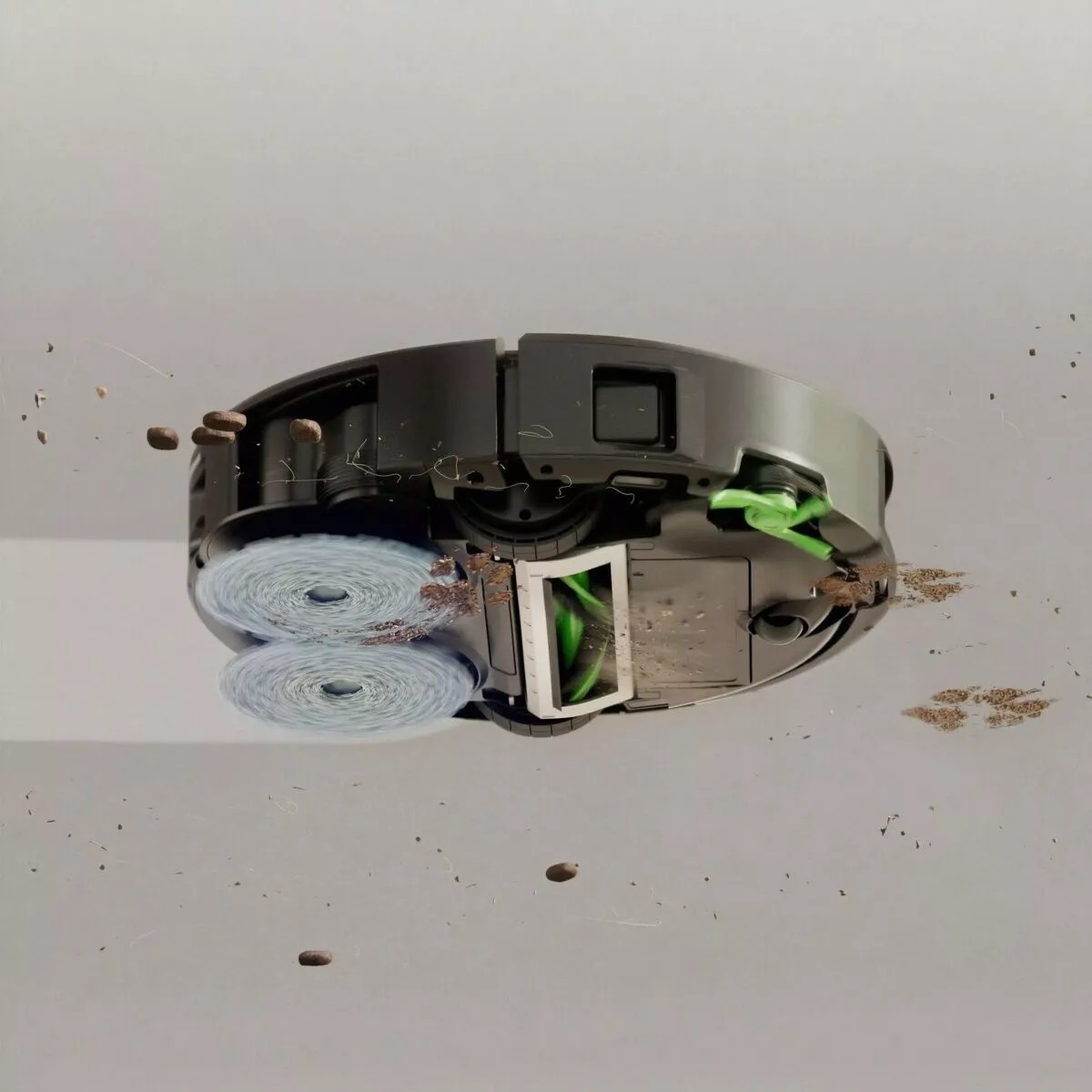 มุมมองด้านล่างของ Roomba® Plus 575 Combo robot ขณะแผ่นถู DualClean™ หมุนขัดคราบ