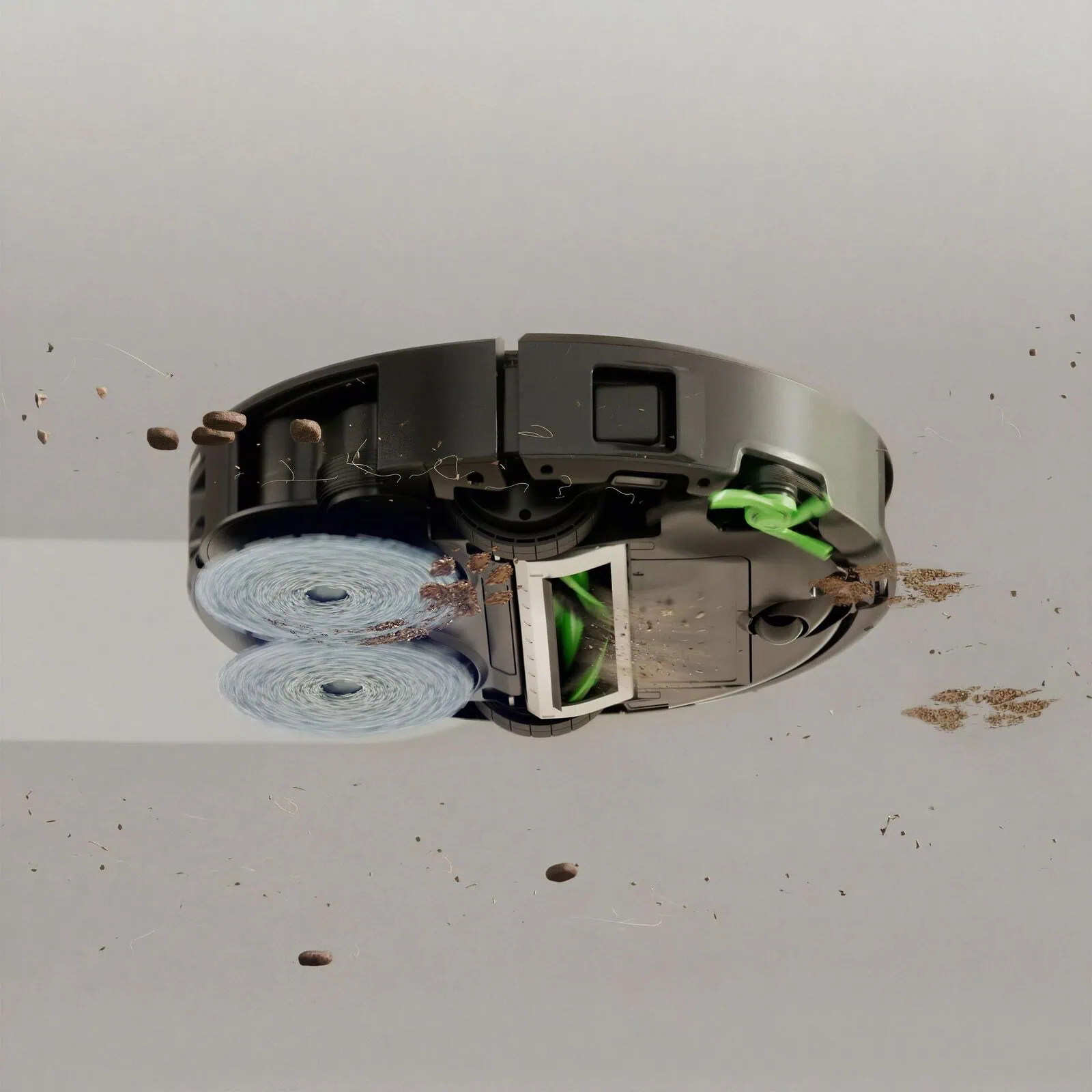 Underside view of the Roomba&reg; Plus 575 Combo robot with the DualClean&trade; mop pads spinning